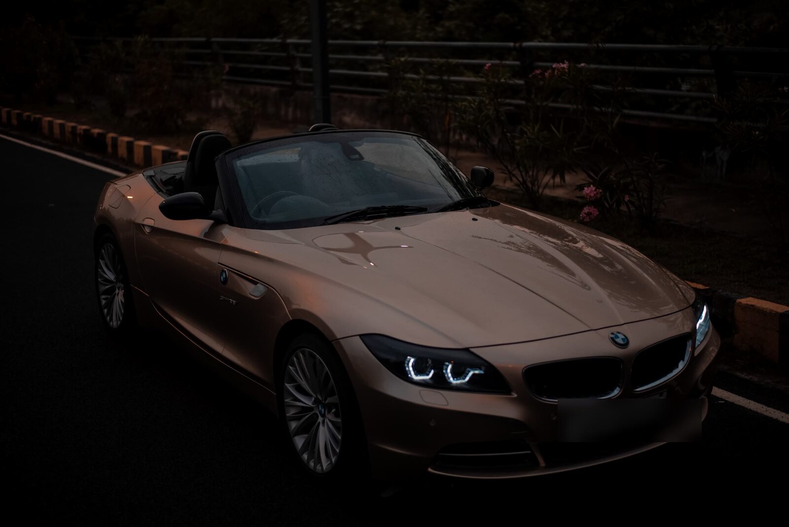 Pre-owned BMW roadster photographed at dusk